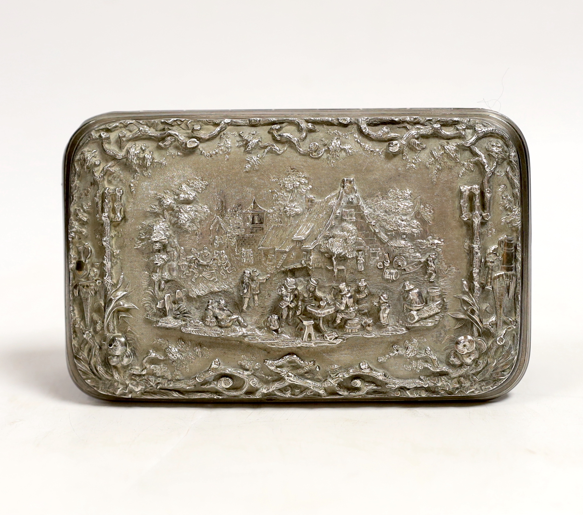 An Indian? white metal cigar case, decorated with figures at various pursuits in relief, 13.5cm, gross weight 309 grams.